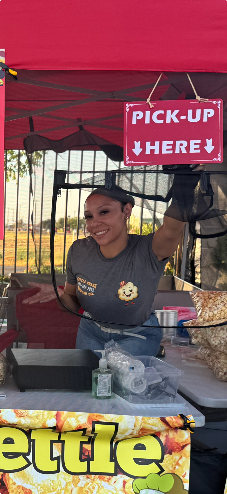 La Vonna smiling at the Kettle Kraze popcorn booth